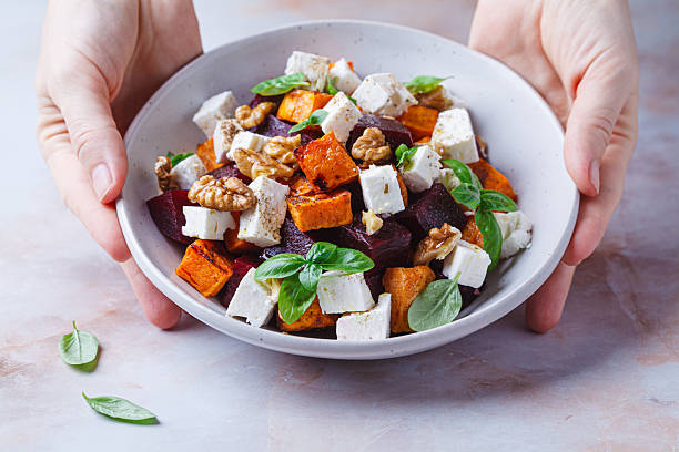 istock Salad with sweet potato, beetroot, feta and walnuts. 2233108110