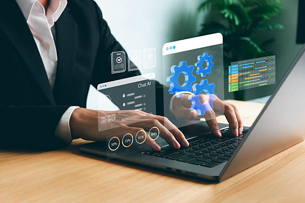 istock Businessman working on laptop with AI chat interface and automation system dashboard, representing artificial intelligence development, data analysis, and productivity technology. 2233114543