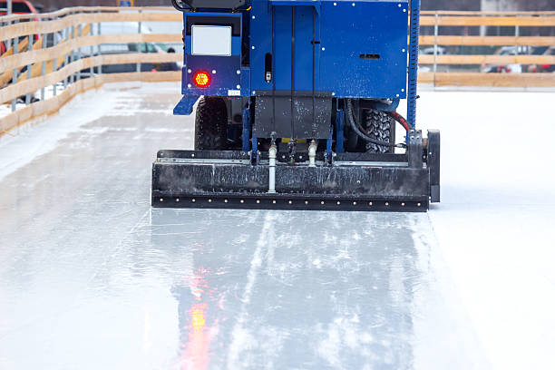 istock Ice resurfacer machine preps skating rink for winter activities during a clear day 2233114595
