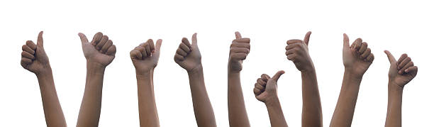 istock Child's hand showing thumb up, like, isolated on a white background 2233114636