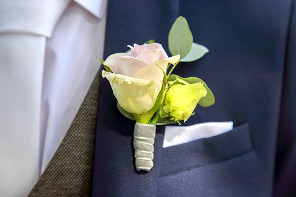 istock Elegant boutonniere displayed on a suit pocket in a formal setting during a wedding ceremony 2233116221
