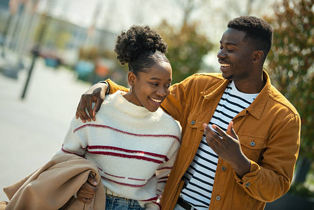 istock Young couple walking city streets. 2233116318