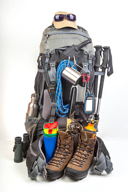 istock Hiking gear setup for outdoor adventures with backpack, boots, and accessories 2233117832