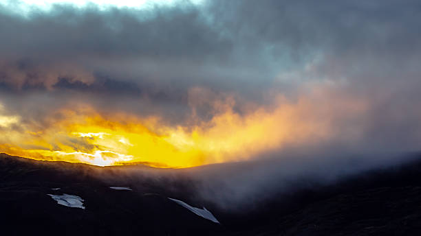 istock Dramatic sunset over Icelandic mountains with vibrant colors and cloudy sky 2233120279