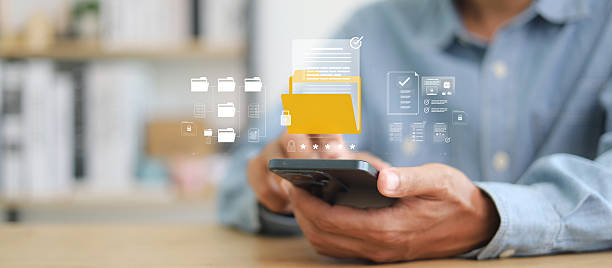 istock Privacy protection, secret secured lock, safety or security to archive file or document. Person holding lock document file folder with padlock. 2233121909