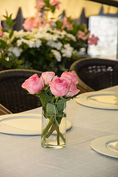 Pink roses in transparent bowl