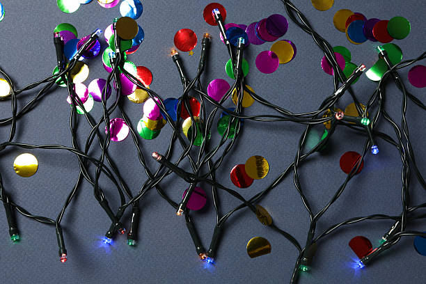 istock Garland with colored lights on gray background, top view 2233122471