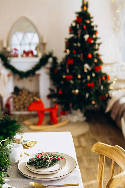 istock Cozy holiday dining setup with festive decorations in a warm room 2233123660