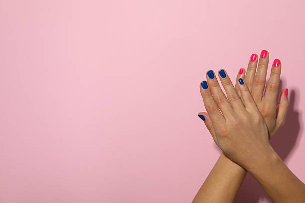 istock Blue and pink manicure on female hands 2233123875