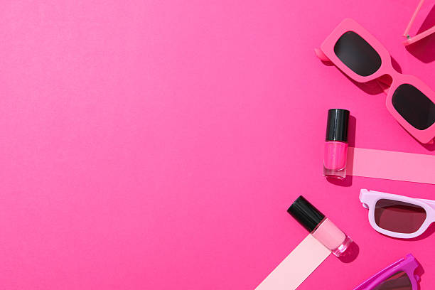 istock Nail polishes with accessories on a pink background 2233124532