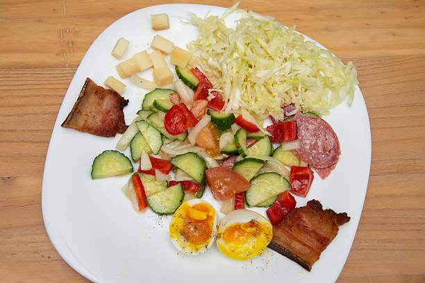 istock Cabbage salad, tomatoes, onions, cucumbers with bacon and 5-minute hard-boiled egg 2233124846