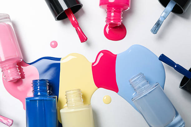 istock Multicolored open nail polishes on a white background 2233124922