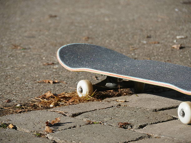 A young man performs dynamic maneuvers on a surfskate in a waveramp skate park. He rides the curves and edges with agility, dressed in casual summer attire. The photos capture the movement and energy of skate culture in an urban outdoor setting.