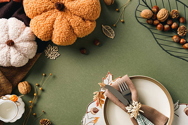 istock Festive autumn table setting with plush pumpkins, nuts, berries, and rustic decor. Perfect for Thanksgiving, seasonal gatherings, and cozy fall inspiration. 2233131340