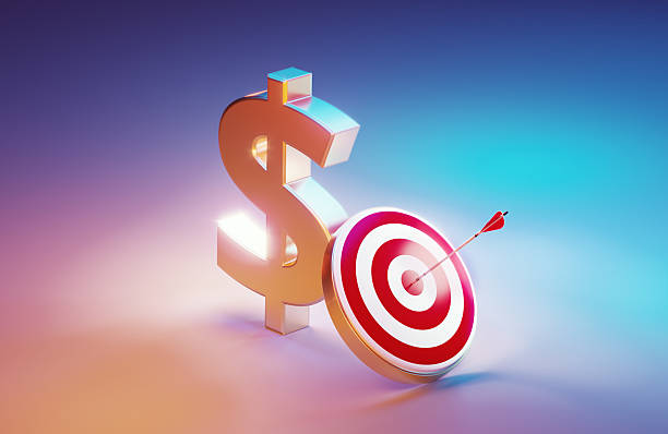 istock Silver Colored American Dollar Sign And Red Target  Illuminated By Blue And Pink Lights On Pink Background 2233132623