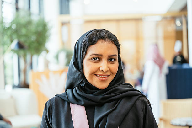 istock Beautiful young Arab woman with hijab  working  in modern bright office space 2233132873