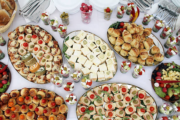 Birthday party catering buffet with different food snacks and appetizers