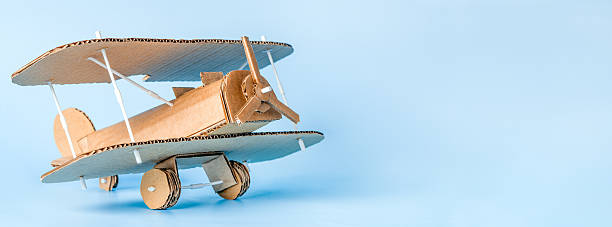 istock DIY cardboard airplane craft creative background with copy space 2233136909