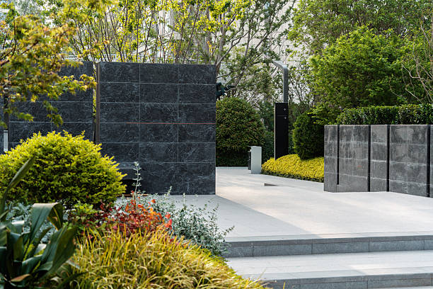 istock Clean-lined dark stone boundary walls and sculpted shrubbery forming a refined residential entryway. 2233137621