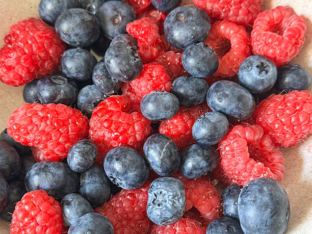istock Image of assorted summer berries in a dish with blueberries and raspberries, nutritious healthy eating snack, vibrant fresh fruit, clean diet concept 2233139974