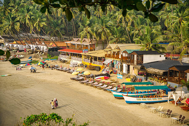 istock Vibrant Tropical Beachfront Scene with Colorful Cabins in Goa, India 2233143747