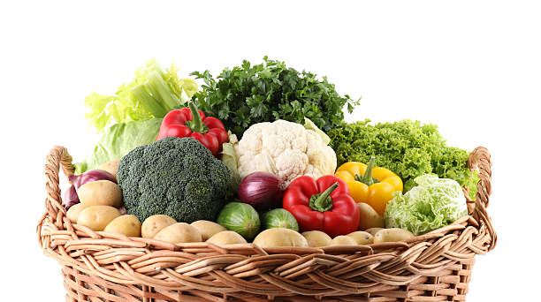 istock Different fresh vegetables in wicker basket isolated on white 2233144428