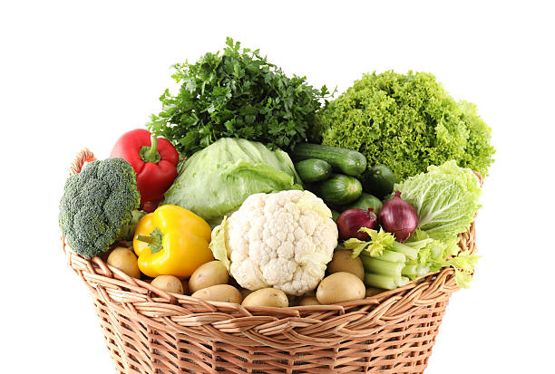 istock Different fresh vegetables in wicker basket isolated on white 2233144586