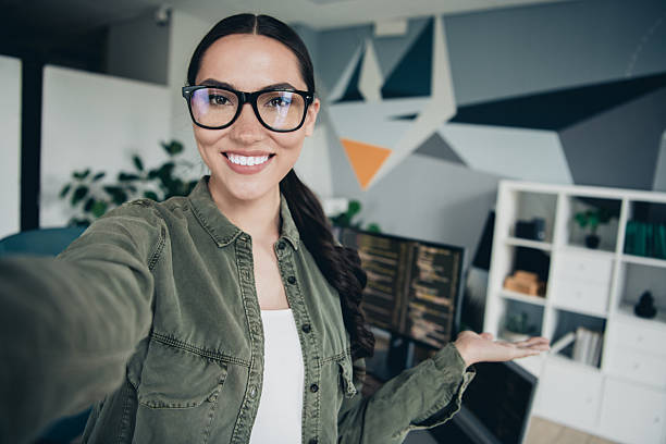 istock Young female programmer working in a modern office environment showcasing her workspace and computer setup 2233146484