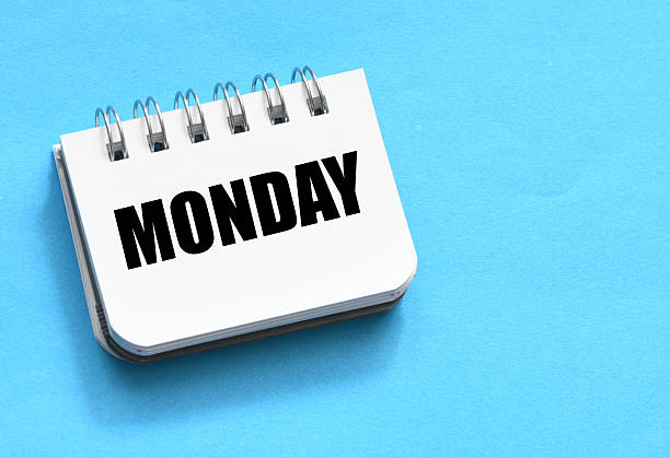 MONDAY word on a small piece of paper.