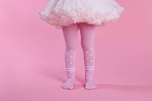 istock Child wearing tights on pink background, closeup 2233150157