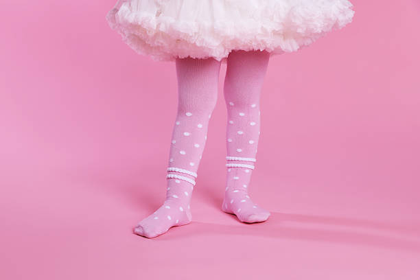 istock Child wearing tights on pink background, closeup 2233150167