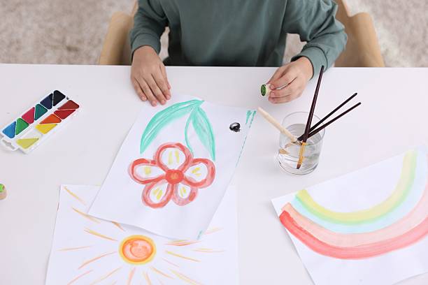 istock Little boy drawing at white table indoors, closeup 2233151417