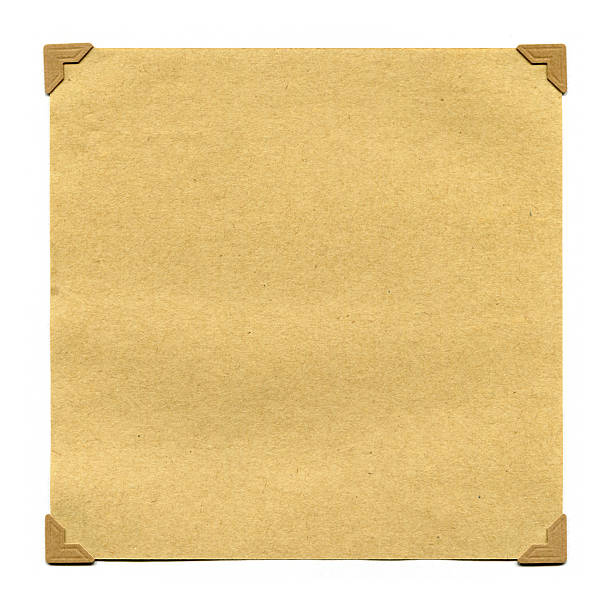 Sheets of paper hang vertically against the brown background. Torn blank sheets from the notepad on a spring. Side view. Copy space