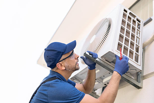 istock Repairman fixing AC outdoor unit. 2233153944