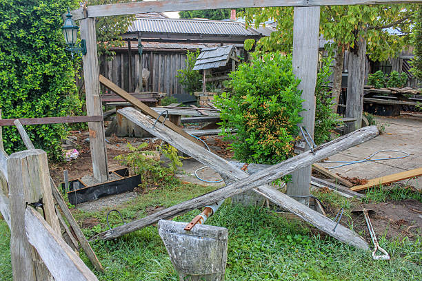 Old office equipment and garbage fly tipped outside the back of an old building