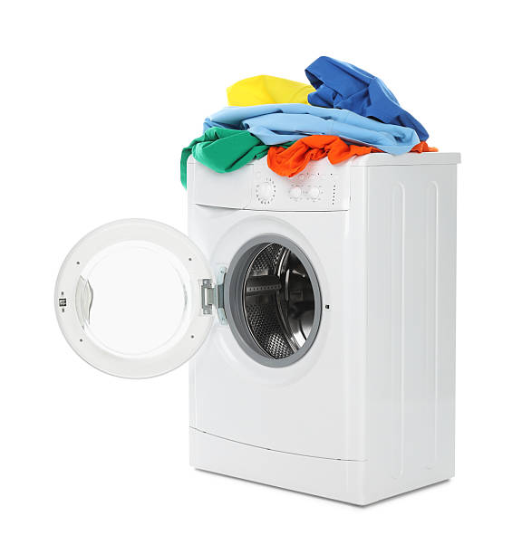istock Modern washing machine with colorful laundry isolated on white 2233158174