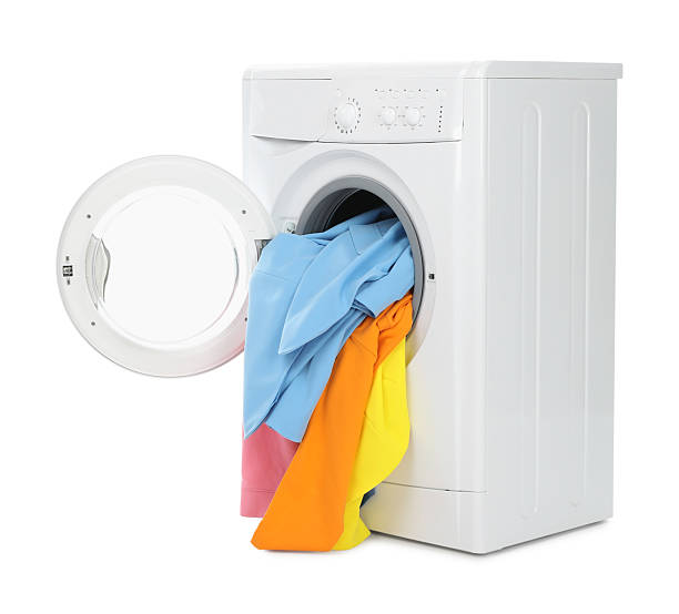 istock Modern washing machine with colorful laundry isolated on white 2233158178