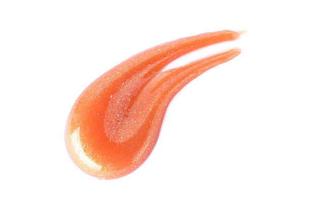 istock Sample of orange lipgloss isolated on white, top view 2233158184