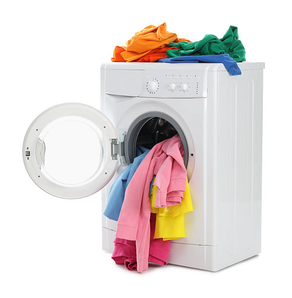 istock Modern washing machine with colorful laundry isolated on white 2233158255