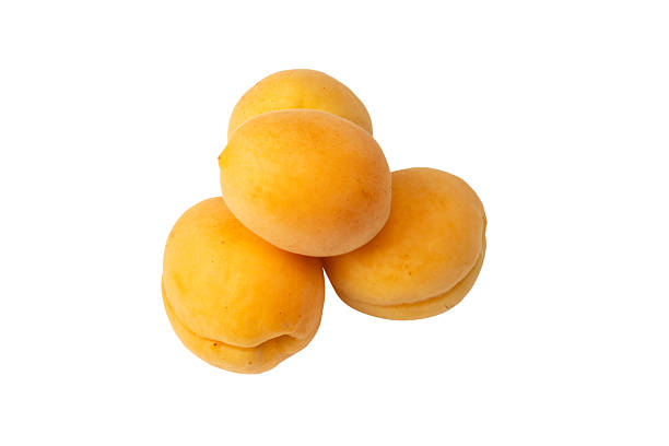 istock Ripe juicy orange apricots isolated on white background. 2233158641