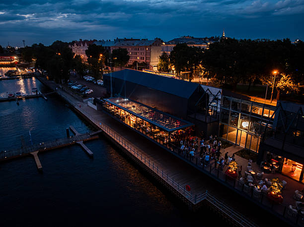 istock Waterfront Venue with Glass Panels and Dock at Night 2233159580