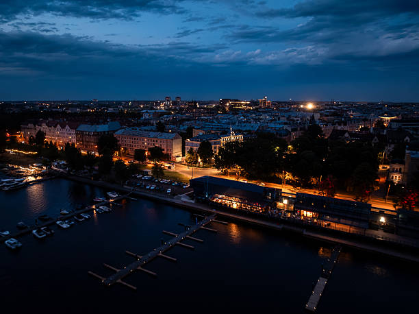 istock Twilight Waterfront with Marina and Illuminated Buildings 2233159586