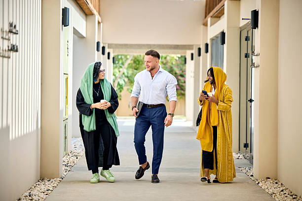 istock Business professionals walking in corridor 2233160497
