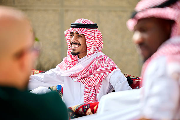 istock Happy Saudi businessman with colleagues at yard 2233160730