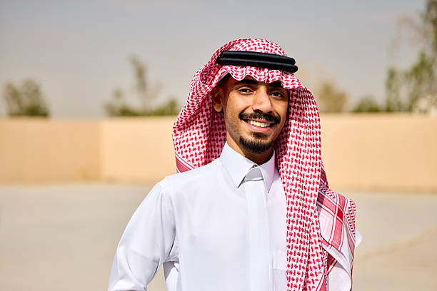 istock Happy young Saudi businessman at office courtyard 2233160836