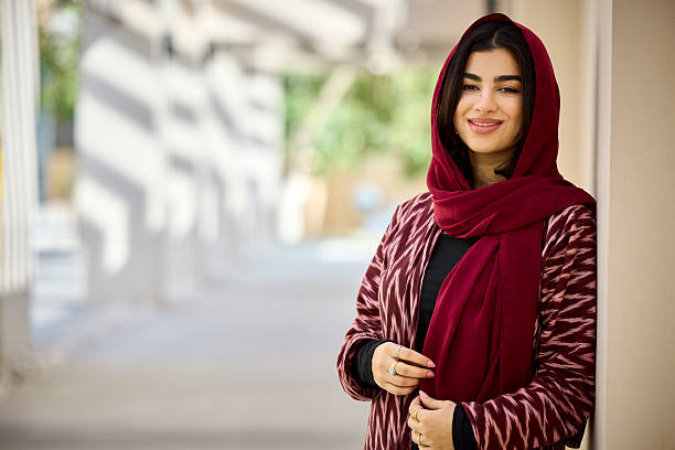 istock Confident businesswoman smiling at office corridor 2233161029