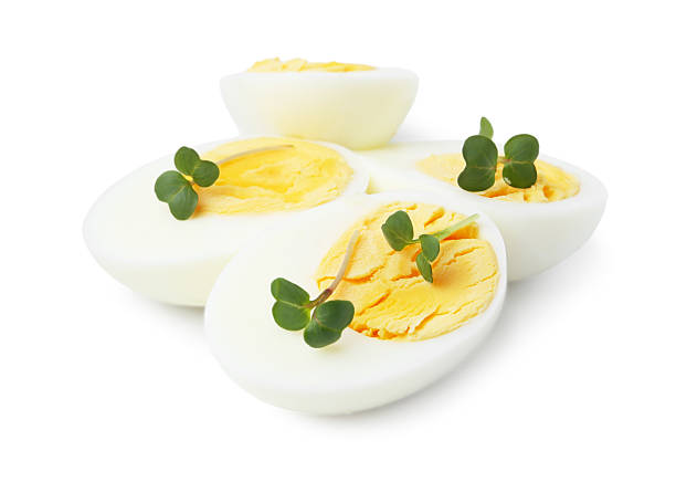 istock Halves of hard boiled eggs isolated on white 2233162775