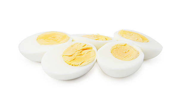 istock Halves of hard boiled eggs isolated on white 2233162794