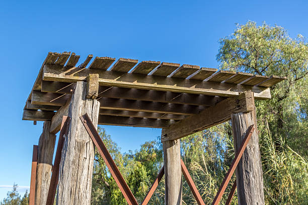 Historic timber water tank stand, showcasing rustic construction and rural heritage. Outdoor scene highlighting agricultural infrastructure, iconic farm architecture, and countryside charm