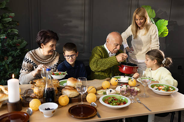 istock Family Gathering Around Festive Dinner Table During Holiday Celebration 2233163508